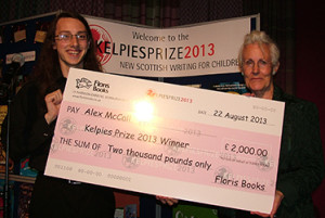 Winner Alex McCall receives his giant cheque!