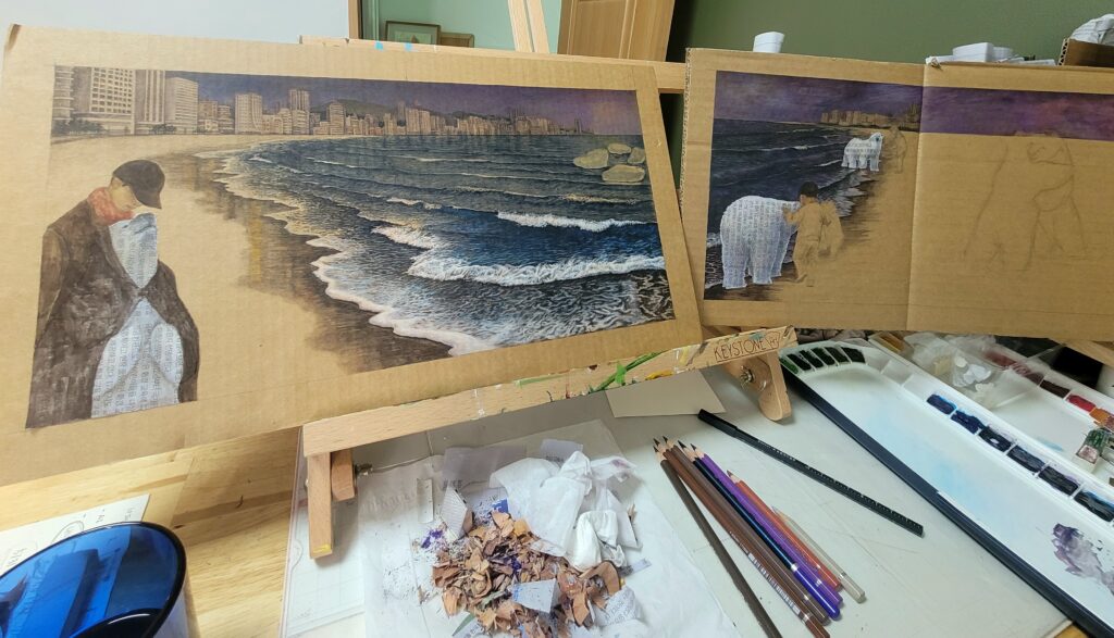 Artist’s workspace with a partially completed children’s book illustration of a beach and city skyline, including a child and a polar bear made of text, surrounded by pencils, paint palette, and drawing tools.