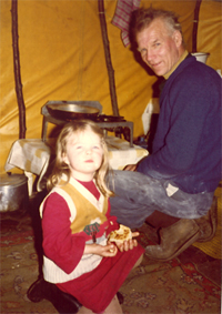 Photograph of Duncan Williamson making flapjacks with a child