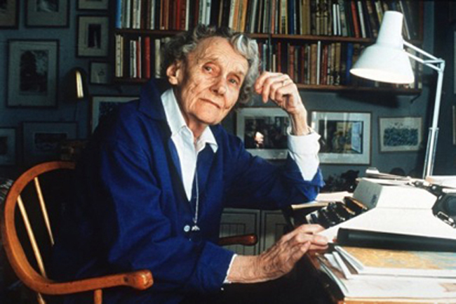 Photograph of Astrid Lindgren, author of Swedish children's books, at her typewriter